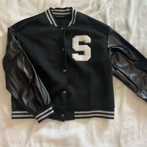 Black Varisty Jacket With White Lettering “S”